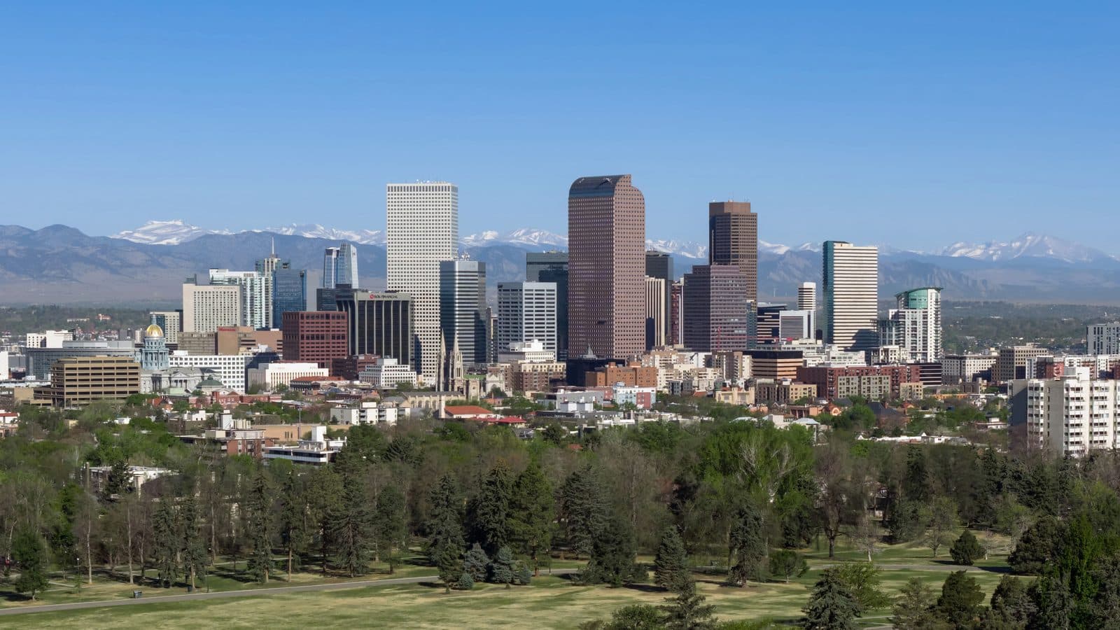 Denver with the Rocky Mountains behind it